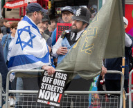 Enough Is Enough Pro Israeli counter protest facing a pro Palestine march through central London, UK.