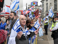 Enough Is Enough Pro Israeli counter protest facing a pro Palestine march through central London, UK.