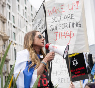 Enough Is Enough Pro Israeli counter protest facing a pro Palestine march through central London, UK.