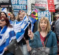 Enough Is Enough Pro Israeli counter protest facing a pro Palestine march through central London, UK.