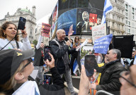 Enough Is Enough Pro Israeli counter protest facing a pro Palestine march through central London, UK.