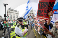 Enough Is Enough Pro Israeli counter protest facing a pro Palestine march through central London, UK.