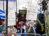Enough Is Enough Pro Israeli counter protest facing a pro Palestine march through central London, UK.