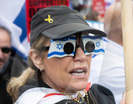 Enough Is Enough Pro Israeli counter protest facing a pro Palestine march through central London, UK.
