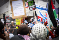 Enough Is Enough Pro Israeli counter protest facing a pro Palestine march through central London, UK.