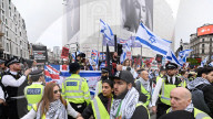 Enough Is Enough Pro Israeli counter protest facing a pro Palestine march through central London, UK.