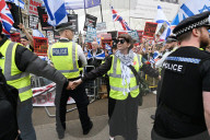 Enough Is Enough Pro Israeli counter protest facing a pro Palestine march through central London, UK.