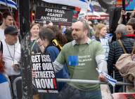 Enough Is Enough Pro Israeli counter protest facing a pro Palestine march through central London, UK.