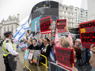 Enough Is Enough Pro Israeli counter protest facing a pro Palestine march through central London, UK.