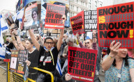 Enough Is Enough Pro Israeli counter protest facing a pro Palestine march through central London, UK.