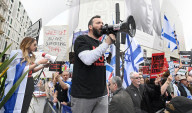 Enough Is Enough Pro Israeli counter protest facing a pro Palestine march through central London, UK.
