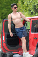 *EXCLUSIVE* A shirtless Justin Jedlica shows off his perfect physique while standing on the side of his Jeep