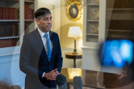 The Prime Minister Rishi Sunak reacts to inflation figures