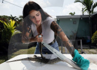 Florida woman makes fashion out of dead Pythons