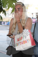 *EXCLUSIVE* Amanda Bynes Makes a Chic Entrance, Gift in Hand, to Friend's Birthday Bash!
