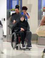 *EXCLUSIVE* Sinbad appears in a wheelchair at LAX, a year and a half after suffering a near-fatal stroke **WEB MUST CALL FOR PRICING**