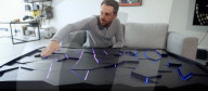 Interactive table has shape shifting surface and lights display