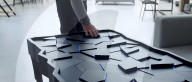Interactive table has shape shifting surface and lights display