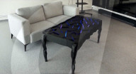 Interactive table has shape shifting surface and lights display