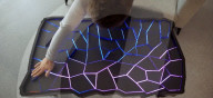 Interactive table has shape shifting surface and lights display