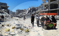 Gazans return to Jabalia                                                                                                                        homes following the withdrawal of the Israeli army from the Jabalia area in the northern Gaza Strip