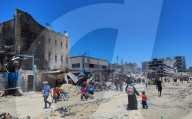 Gazans return to Jabalia                                                                                                                        homes following the withdrawal of the Israeli army from the Jabalia area in the northern Gaza Strip