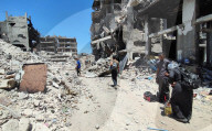 Gazans return to Jabalia                                                                                                                        homes following the withdrawal of the Israeli army from the Jabalia area in the northern Gaza Strip