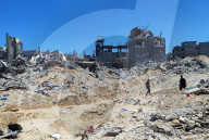 Gazans return to Jabalia                                                                                                                        homes following the withdrawal of the Israeli army from the Jabalia area in the northern Gaza Strip