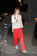 *EXCLUSIVE* Dakota Johnson is vibrant in red trousers after leaving film set