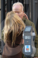 *EXCLUSIVE* Tobin Bell shares a romantic kiss with a mystery woman after dinner in Beverly Hills