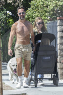 *EXCLUSIVE* Chris Diamantopoulos and Becki Newton enjoy a sunny stroll with their son in LA