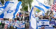 Enough Is Enough Pro Israeli counter protest facing a pro Palestine march through central London, UK.