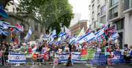 Enough Is Enough Pro Israeli counter protest facing a pro Palestine march through central London, UK.