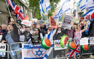 Enough Is Enough Pro Israeli counter protest facing a pro Palestine march through central London, UK.