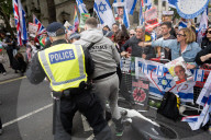 Enough Is Enough Pro Israeli counter protest facing a pro Palestine march through central London, UK.