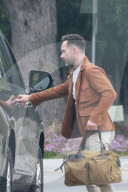 *EXCLUSIVE* Chris Diamantopoulos departs his house in style