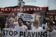 Climate Change Activists Are Protesting Outside The National Park During The Annual Congressional Baseball Game In Washington DC, USA