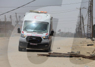 A fraying Palestinian flag flies near a field hospital of the International Medical Corps in the western part of Rafah in the southern Gaza Strip