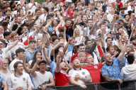 Fans watch Serbia v England in London, UK.