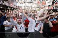 Fans watch Denmark v England at BOXPARK Croydon, UK.