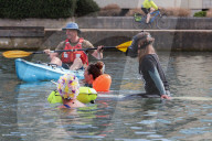 'Surfers Against Sewage' stage protest on the River Thames