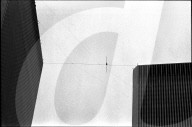 Philippe Petit walks the Twin Towers