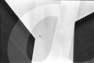 Philippe Petit walks the Twin Towers