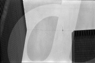 Philippe Petit walks the Twin Towers