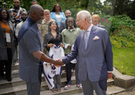 King Charles and Idris Elba with England football shirts