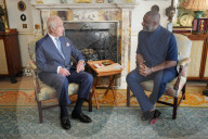 King Charles and Idris Elba with England football shirts