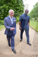 King Charles and Idris Elba with England football shirts