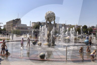 Bathing in Vinnytsia fountain on hot summer day, Ukraine
