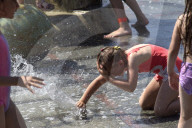 Bathing in Vinnytsia fountain on hot summer day, Ukraine