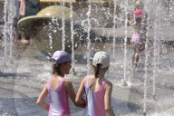 Bathing in Vinnytsia fountain on hot summer day, Ukraine